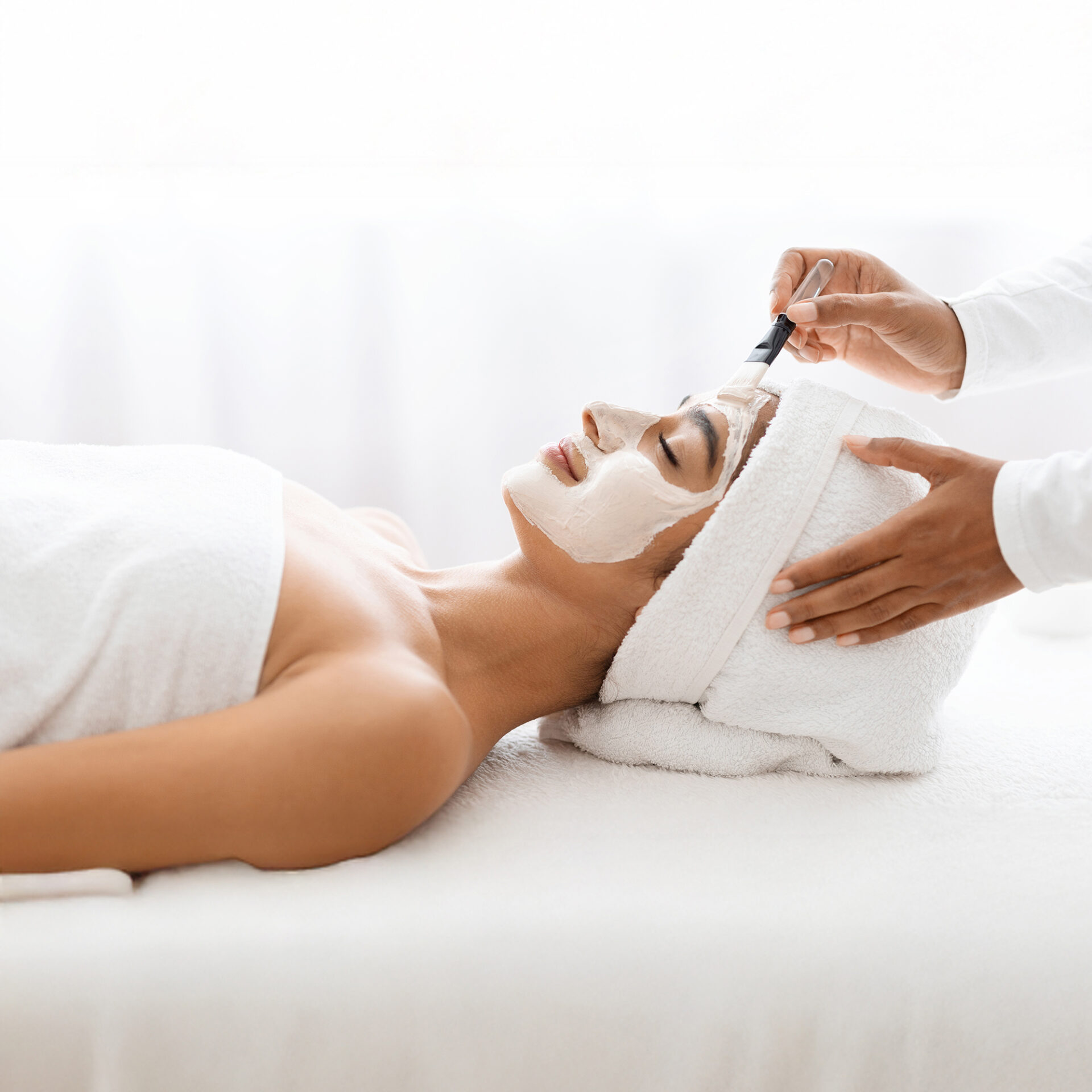 Young Indian lady undergoes a facial skin care procedure